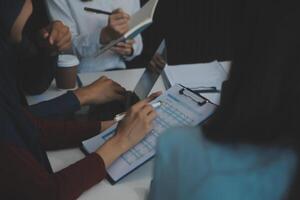 Team of business people working together in the meeting room office, teamwork background charts and graphs banner, double exposure successful teamwork,business planning concept. photo