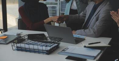 Business people shaking hands after meeting. colleagues handshaking after conference. Greeting deal, teamwork partnership cooperate concept. photo