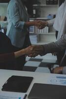 Business people shaking hands after meeting. colleagues handshaking after conference. Greeting deal, teamwork partnership cooperate concept. photo