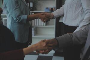 Business people shaking hands after meeting. colleagues handshaking after conference. Greeting deal, teamwork partnership cooperate concept. photo