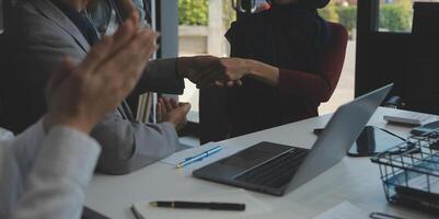 Business people shaking hands after meeting. colleagues handshaking after conference. Greeting deal, teamwork partnership cooperate concept. photo