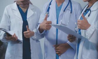 Quality healthcare is all about putting the patient at the centre. Shot of a group of medical practitioners having a discussion in a hospital. photo