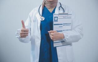 Doctor holding clipboard and stethoscope on background of Hospital ward photo
