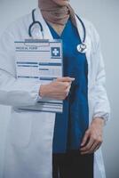 Doctor holding clipboard and stethoscope on background of Hospital ward photo