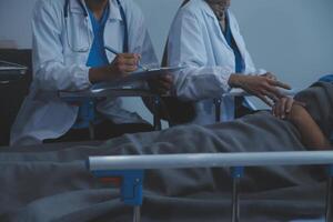 Cropped shot of a female nurse hold her senior patient's hand. Giving Support. Doctor helping old patient with Alzheimer's disease. Female carer holding hands of senior man photo