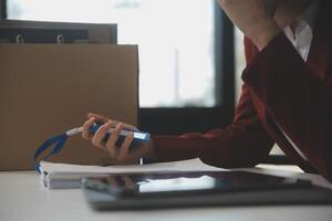 Businesswoman packing her things for move photo