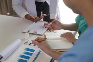 Medical Team Meeting Around Table In Modern Hospital photo