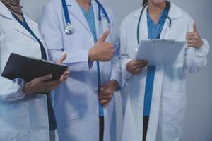 Quality healthcare is all about putting the patient at the centre. Shot of a group of medical practitioners having a discussion in a hospital. photo