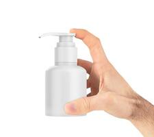 Cosmetic Pump in Hand on white background photo