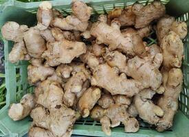 Close up of fresh ginger background. photo