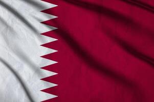 Qatar flag on the background texture. photo