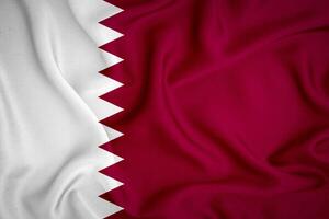 Qatar flag background. Qatar flag with fabric texture photo