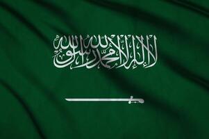 Saudi Arabia flag on the background texture. photo