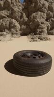 A tire sitting in the middle of a desert video