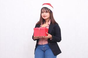 Beautiful Asian girl in suit charming smile with Santa Claus hat posing with Christmas gift box gifts on white background for promotion, advertising, banner, billboard photo