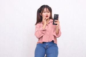 Business, finance and work Improvement projects successful Asian businessman cheerful professional stylish woman holding mobile phone shocked expression looking at camera on white background photo