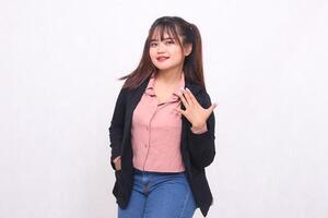 Beautiful Asian businesswoman in suit smile hand sign number 5 down white background studio portrait for advertising materials,banners,billboards,job vacancies,business opportunities photo