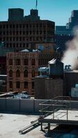 Smoke rising from a chimney on a building roof video