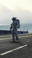 astronaut in space suit on the road bridge video