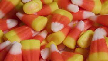 Bright colorful candy corn dolly shot close up Halloween trick or treat video