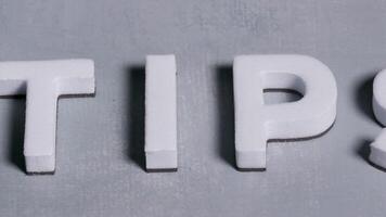 Tips 3d letters close up concept light blue background video