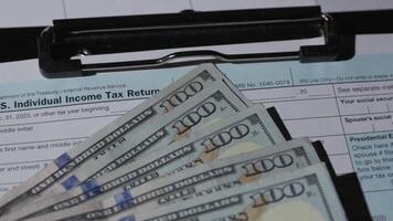 Money currency stack of hundred dollar bills on table video