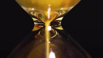 Close up of hourglass sand timer time running out concept 15 video