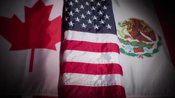 Rack focus of Canada, the United States and Mexico national flags with vignette video