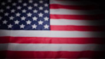 Rack focus of United States USA national flag with vignette video