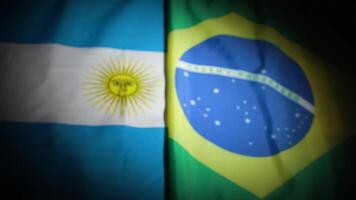 Rack focus of Brazil and Argentina national flags with vignette video