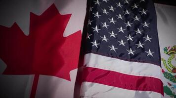 Panning shot of Canada, the United States and Mexico national flags video