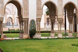 Casablanca, Morocco -march 25, 2024-people visit the famous Hassan Second Mosque during a rainy day photo