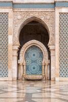 Casablanca, Morocco -march 25, 2024-people visit the famous Hassan Second Mosque during a rainy day photo