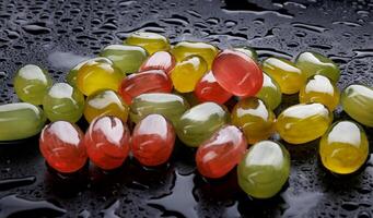 Lots of colorful candies. Multi-colored candies on a black background. Marmalade candies. photo
