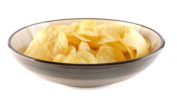 Bowl of potato chips isolated on white background. photo