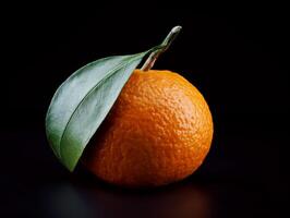 Ripe juicy tangerine on a dark background. photo