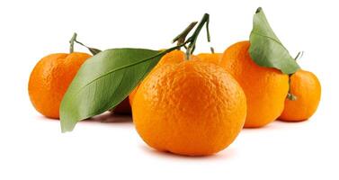 Several ripe tangerines isolated on a white background. Organic tangerine with green leaf. Mandarin. photo
