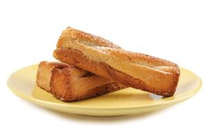 Several delicious crispy cookies lying on a yellow plate isolated on a white background. photo