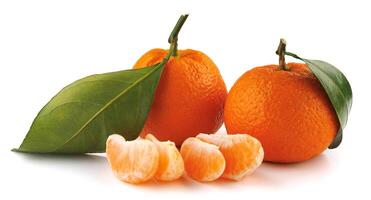 Two ripe tangerines and tangerine slices isolated on a white background. Organic tangerine with green leaf. Mandarin. photo