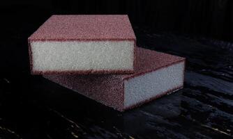 Melamine sponge on a black wet background. Beautiful drops of water around a melamine sponge. photo