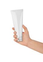Tube Cosmetic in Woman Hand on white background photo