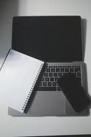 Top view of computer desk with keyboard, smartphone, stationery and coffee cup, clipping path photo