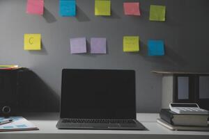 Studio workspace with laptop computer and office supplies. Work from home. With copy space photo