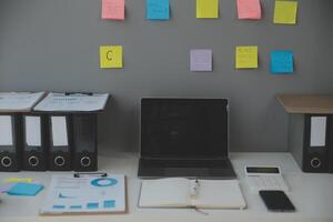 Studio workspace with laptop computer and office supplies. Work from home. With copy space photo