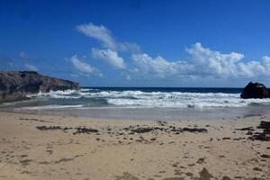 Waves Lapping the Shore at Andicuri Beach in Aruba photo