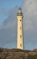 Rugged Landscape Surrounding a Lighthouse photo