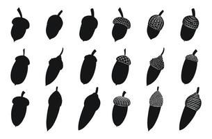 Outline silhouettes of oak acorns and hats, isolated vector