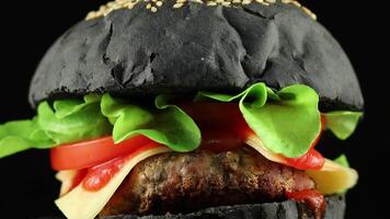 Tasty burger close-up. Burger with tomatoes, greens, onions and meat. video