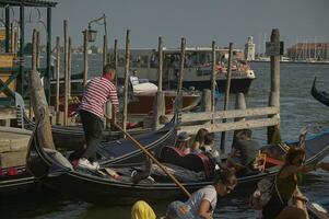 VENICE ITALY 25 MARCH 2019 Gondola in Venice with people on board photo