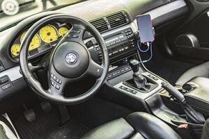 Vicenza Italy 19 March 2024 Detailed view of the BMW M3 E46 s dashboard and instruments epitomizing performance photo